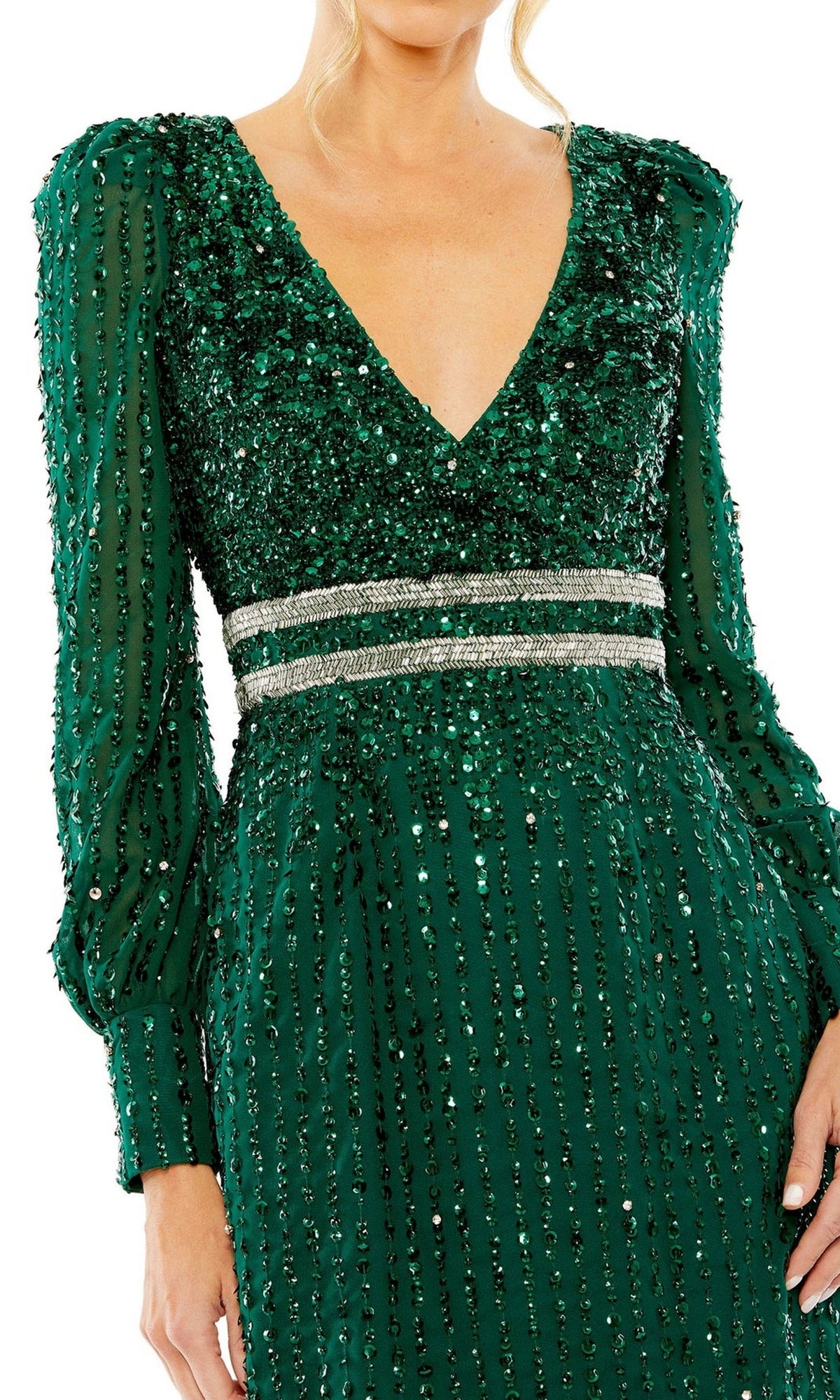 Person wearing the Mac Duggal 93593 knee-length wedding guest dress, featuring long sleeves, a deep V-neck, green sequins, and two silver horizontal waist bands.